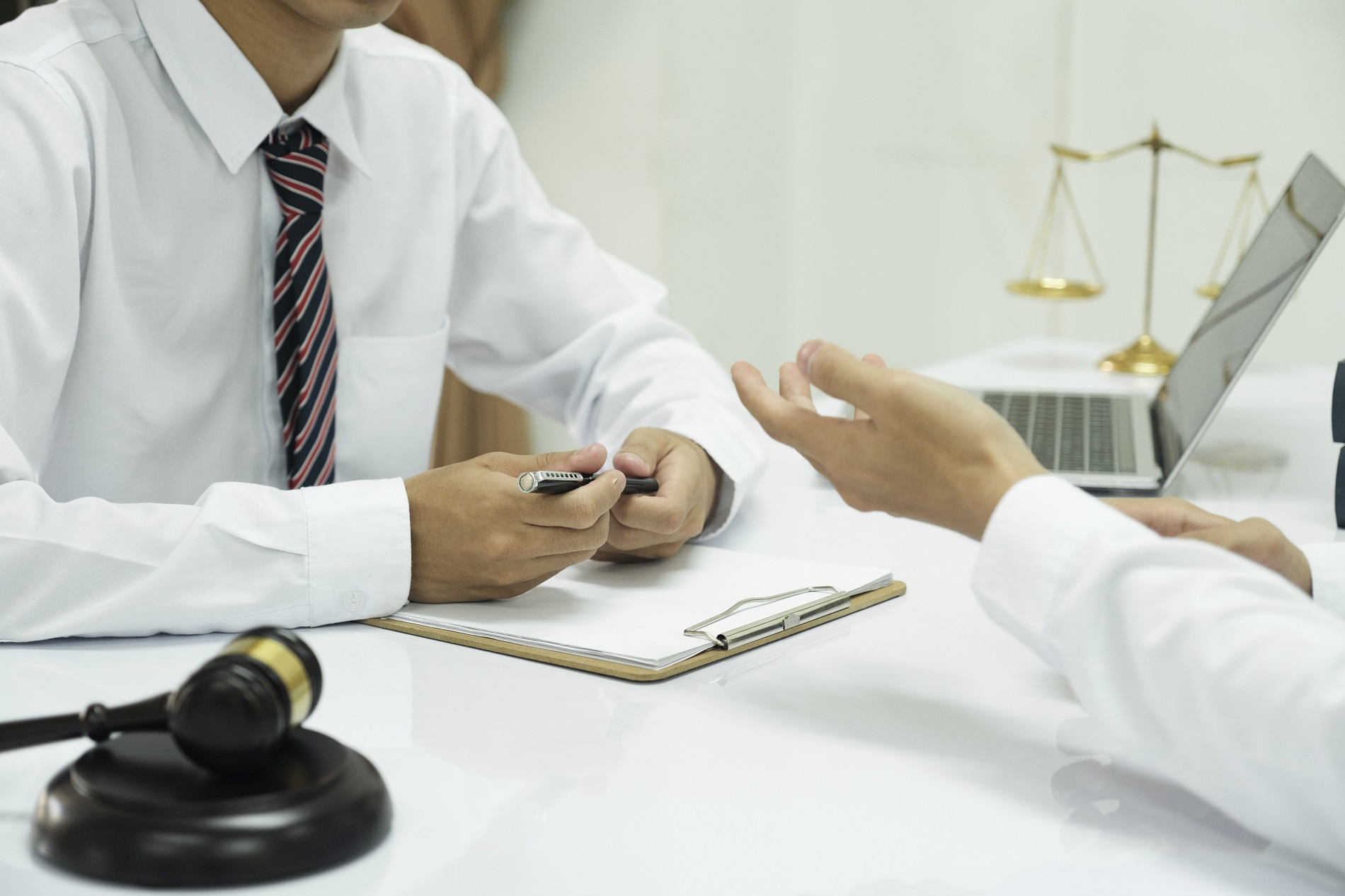 Lawyer Signing Documents and discussing contract papers, Legal s